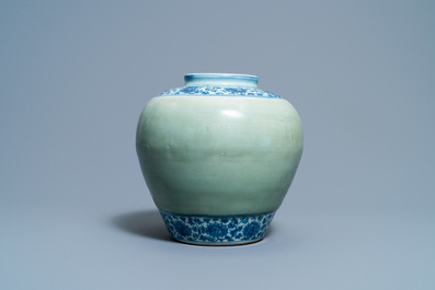 Een Chinese blauw-witte en celadon vaas met lotusslingers, Ming