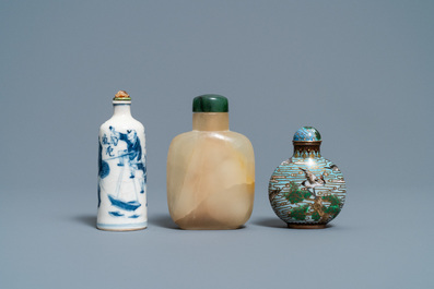 Three Chinese chalcedony, cloisonn&eacute; and porcelain snuff bottles, 19th C.