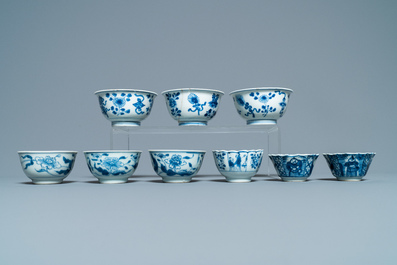 Sixteen Chinese blue and white saucers and fourteen cups, Kangxi