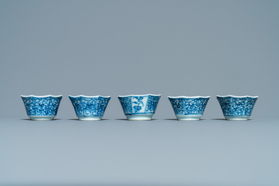 Sixteen Chinese blue and white saucers and fourteen cups, Kangxi