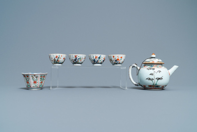 A Chinese famille verte teapot, seven saucers and five cups, Kangxi