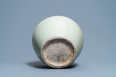 A globular Chinese monochrome celadon 'dragon' vase, Kangxi