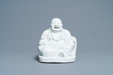 A Chinese Dehua blanc de Chine figure of Buddha, Kangxi
