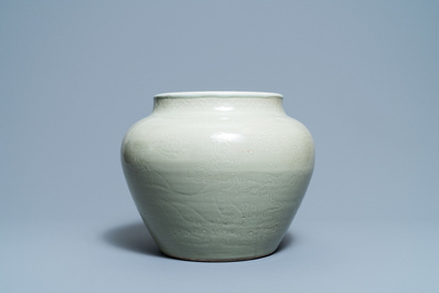 A globular Chinese monochrome celadon 'dragon' vase, Kangxi