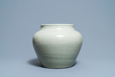 A globular Chinese monochrome celadon 'dragon' vase, Kangxi