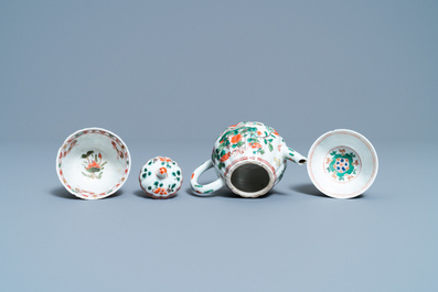 A Chinese famille verte teapot, two cups and three saucers, Kangxi