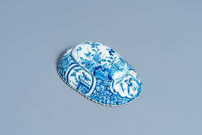 A ribbed Dutch Delft blue and white chinoiserie brush back, 18th C.