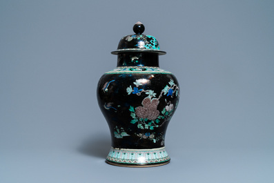 A Chinese famille noire vase and cover, 19th C.