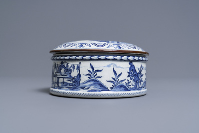 A round Dutch Delft blue and white box and cover with tobacco harvesting scenes, 18th C.