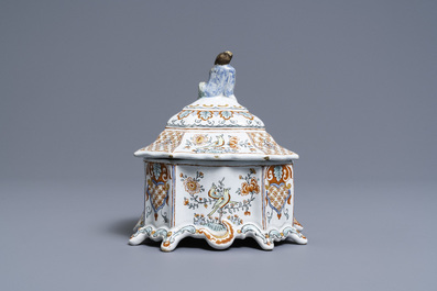 A Dutch Delft polychrome petit feu tobacco box and cover with a seated Chinaman, 18th C.