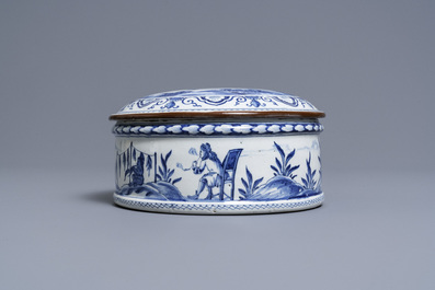 A round Dutch Delft blue and white box and cover with tobacco harvesting scenes, 18th C.
