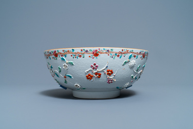 A Chinese famille rose relief-decorated floral bowl, Yongzheng/Qianlong