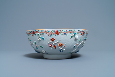 A Chinese famille rose relief-decorated floral bowl, Yongzheng/Qianlong