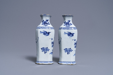 A pair of Dutch Delft blue and white vases and a 'peacock's tail' plate, 18th C.