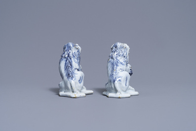 A pair of Dutch Delft blue and white models of lions, 18th C.