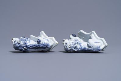 A pair of Dutch Delft blue and white models of lions, 18th C.