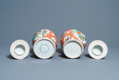 A pair of Chinese famille verte vases and covers, 19/20th C.