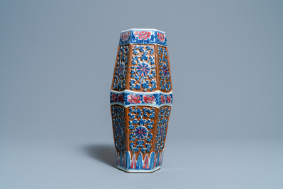 A Chinese hexagonal blue, white and copper-red brown-ground vase, 19th C.