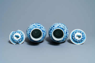 A pair of Chinese blue and white vases and a famille rose jar and cover, 19/20th C.