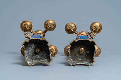 A pair of Chinese blue-ground vases with bronze candelabra mounts, Kangxi and 19th C.