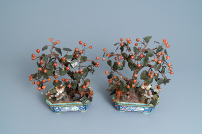 A pair of large Chinese Canton enamel jardini&egrave;res with jade and hardstone trees, 19th C.
