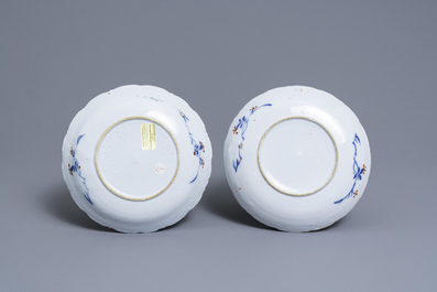 A pair of polychrome petit feu and gilded Dutch Delft famille verte-style chinoiserie plates, 1st quarter 18th C.