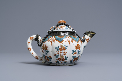 A polychrome petit feu and gilded Dutch Delft teapot and cover, early 18th C.