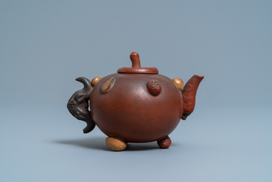 A Chinese Yixing stoneware teapot and cover with applied nuts, 19/20th C.