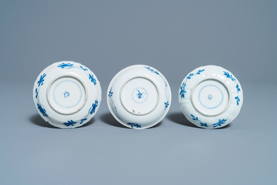 A collection of Chinese and Japanese blue and white cups and saucers and two ewers, Wanli and later