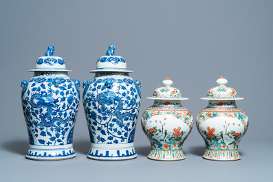 Two pairs of Chinese blue and white and famille verte vases and covers, 19/20th C.