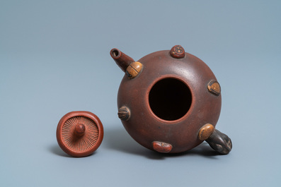 A Chinese Yixing stoneware teapot and cover with applied nuts, 19/20th C.