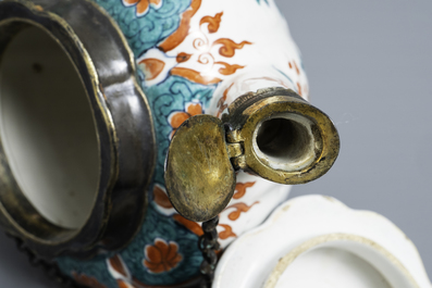 A polychrome petit feu and gilded Dutch Delft teapot and cover, early 18th C.