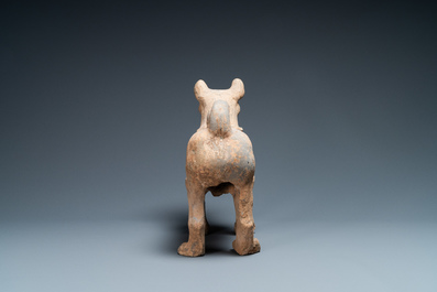 A large Chinese grey pottery model of a dog, Han