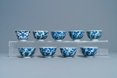 A collection of Chinese and Japanese blue and white cups and saucers and two ewers, Wanli and later