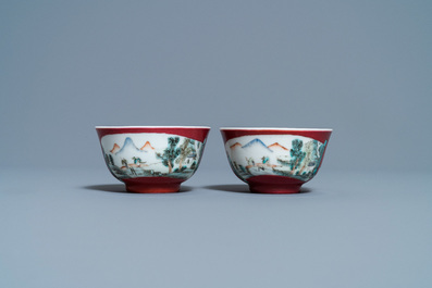 A pair of Chinese famille rose ruby-ground cups and saucers, Yongzheng