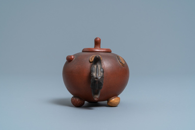 A Chinese Yixing stoneware teapot and cover with applied nuts, 19/20th C.