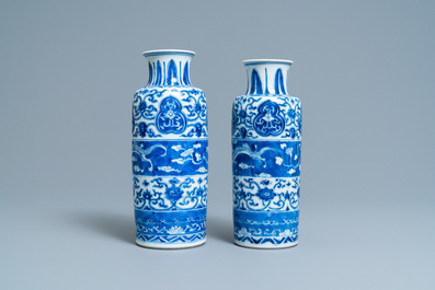 Two Chinese blue and white rouleau vases with horizontal dragon panels, Kangxi