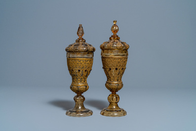 A pair of Russian or Eastern-European gilt copper and glass-inlaid glass goblets and covers, 19th C.