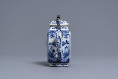 A rare Dutch Delft blue and white relief-moulded teapot and cover, late 17th C.