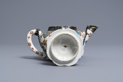 A polychrome petit feu and gilded Dutch Delft teapot and cover, early 18th C.