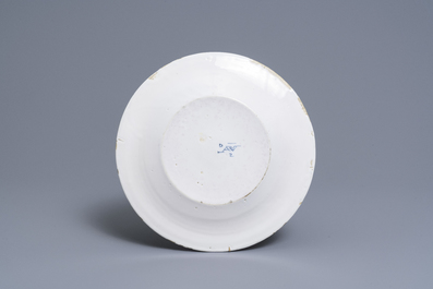 A Dutch Delft blue and white dish with the arms of James I, dated 1698