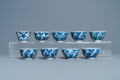 A collection of Chinese and Japanese blue and white cups and saucers and two ewers, Wanli and later