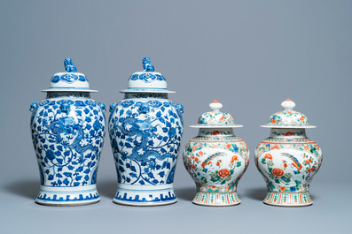 Two pairs of Chinese blue and white and famille verte vases and covers, 19/20th C.