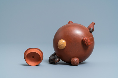 A Chinese Yixing stoneware teapot and cover with applied nuts, 19/20th C.