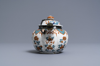 A polychrome petit feu and gilded Dutch Delft teapot and cover, early 18th C.