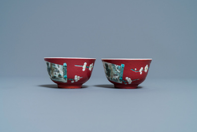 A pair of Chinese famille rose ruby-ground cups and saucers, Yongzheng