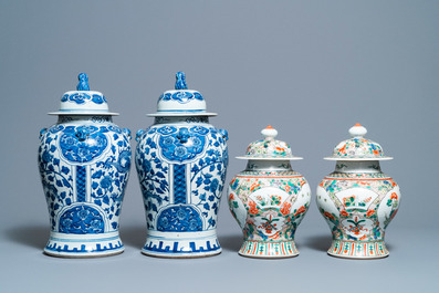 Two pairs of Chinese blue and white and famille verte vases and covers, 19/20th C.