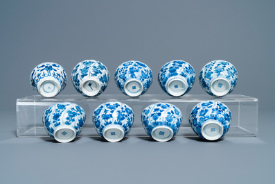 A collection of Chinese and Japanese blue and white cups and saucers and two ewers, Wanli and later