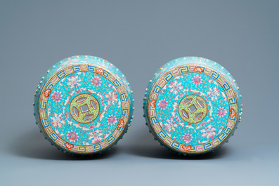 A pair of Chinese turquoise-ground famille rose garden seats, 19th C.