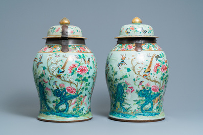 A pair of large Chinese Canton famille rose celadon-ground vases and covers, 19th C.